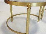 pair of brass and marble coffee tables with brass bases