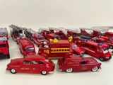a lot of toy fire trucks that are on the table