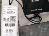 a picture of a bag with a tag attached to it