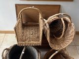 a cat laying on the floor next to a basket