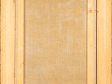 a close up of a painting of a wooden frame on a wall