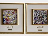 four framed paintings of different colors and designs on a white wall