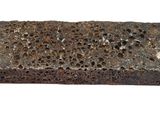 a brick with holes in it on a white background