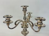 a silver candelab with three candles on it