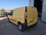 the back of a yellow van parked in a parking lot