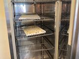a refrigerator with a lot of food inside of it