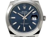 a close up of a watch with a blue dial on a bracelet
