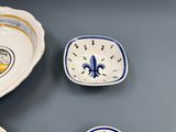a bowl, bowl, and plate sitting on a table