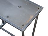 a metal table with a metal top on a white background