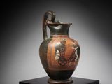 an image of a vase with a bird on it on a stand