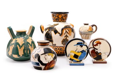 many different types of vases on display on a white surface