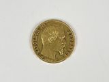 an image of a gold coin with a woman ' s face on it