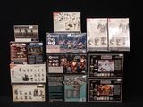 many different boxes of action figures on a black background