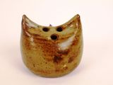 an image of a small ceramic owl figurine sitting on a white surface