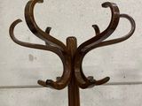a wooden coat rack with a deer ' s head on it