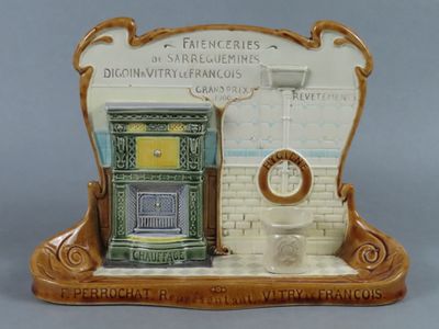 a ceramic figurine of a bathroom with a toilet and sink