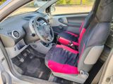 the interior of a car with two seats and a steering wheel