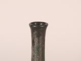 a small vase that is sitting on a table