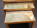 three tables that have glass tops on them in a room