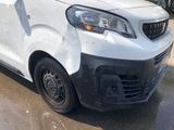 a white van that has been vandalized and is parked on the street
