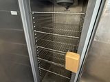 an open door to a stainless steel oven in a kitchen