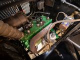 a close up view of a green engine and some pipes