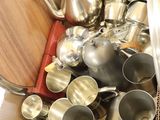 a box full of silverware on the floor