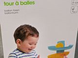 packaging of a box of baby toys for sale on a store shelf