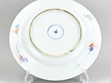an image of a blue and white plate with a gold rim