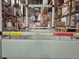 an image of a factory with a conveyor belt in the middle of it