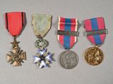 several medals are displayed on a table with a white background