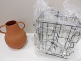 a vase and a plastic bag sitting on a table