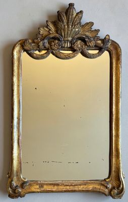 an image of a mirror hanging on a wall in a room