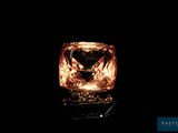 an orange diamond is shown in the dark