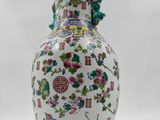 an image of a vase with flowers on it sitting on a table