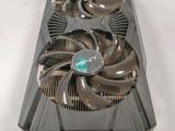 a close up of a video card with a fan on top of it