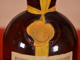 a bottle with a label on it sitting on a table