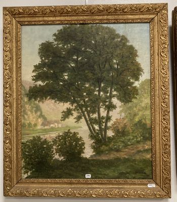 tableau représentant un arbre et une rivière, dans un cadre doré, accroché au mur