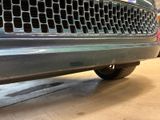 a close up of a truck with a grill on it ' s grill