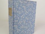 the book is blue and white with a floral pattern on it