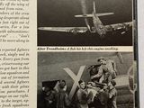 an old book with a picture of a group of people standing in front of a plane