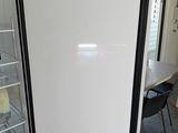 a refrigerator with a glass door in a kitchen