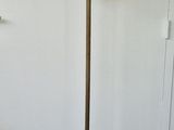 a lamp that is sitting on a stand in a room