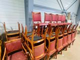 a lot of chairs that are sitting in a room