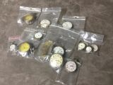 many different types of watches in bags on the floor