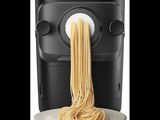 an image of a pasta maker being used to make pasta