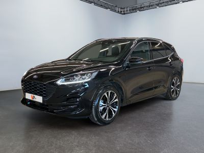 a black ford kuga parked in a large room