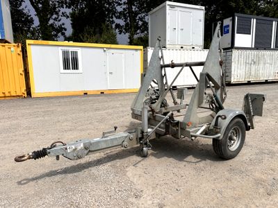 a trailer with a trailer attached to it in a parking lot