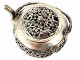 a silver teapot with a handle on a white background