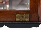 a close up of a wooden display case with a clock on it